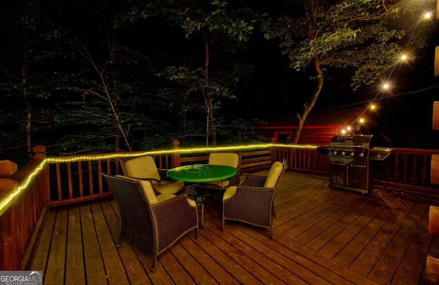 deck at twilight with grilling area