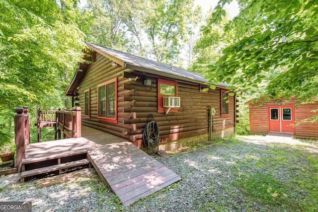 view of home's exterior with a wooden deck