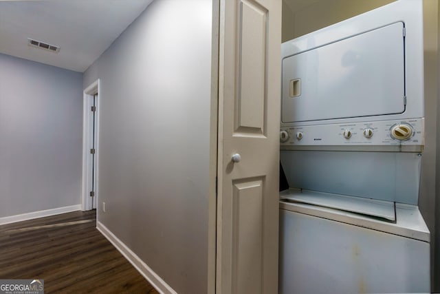 2911 Glenwood Ave SE, Atlanta, GA 30317 - laundry area featuring stacked washer / drying machine and dark wood-type flooring
