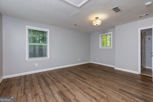 2911 Glenwood Ave SE, Atlanta, GA 30317 - spare room featuring dark wood-type flooring