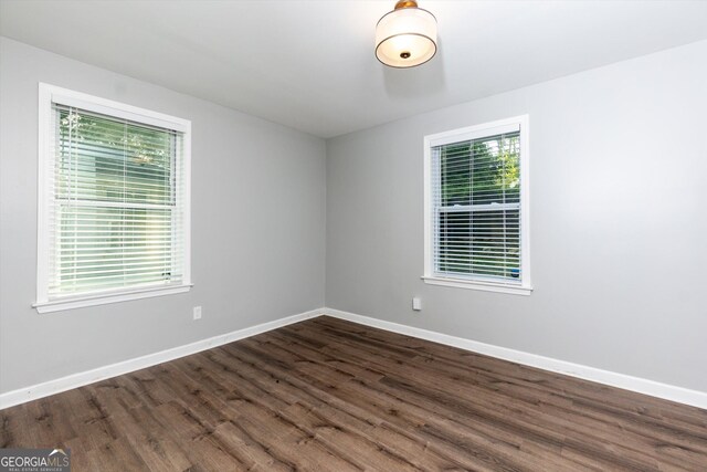 2911 Glenwood Ave SE, Atlanta, GA 30317 - spare room with dark wood-type flooring