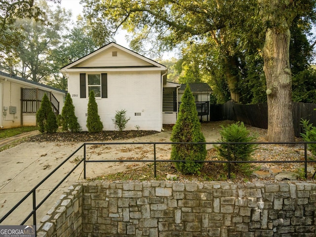 view of side of property with a patio