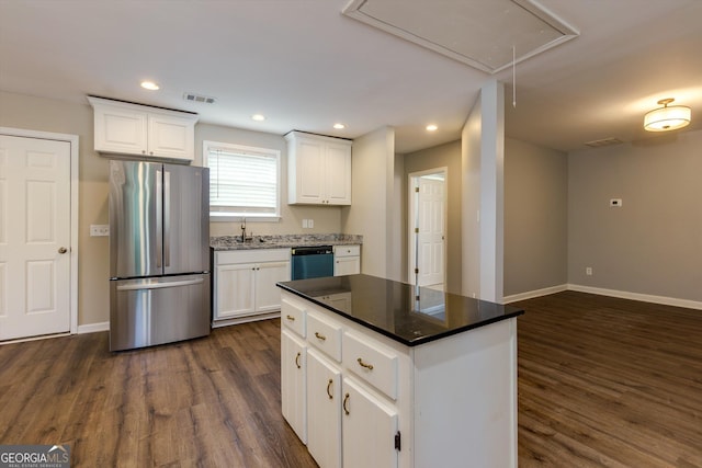 2911 Glenwood Ave SE, Atlanta, GA 30317 - kitchen with white cabinets, appliances with stainless steel finishes, dark wood-type flooring, and a kitchen island