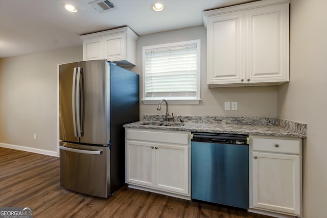 2911 Glenwood Ave SE, Atlanta, GA 30317 - kitchen featuring white cabinetry, sink, stainless steel appliances, and dark hardwood / wood-style flooring