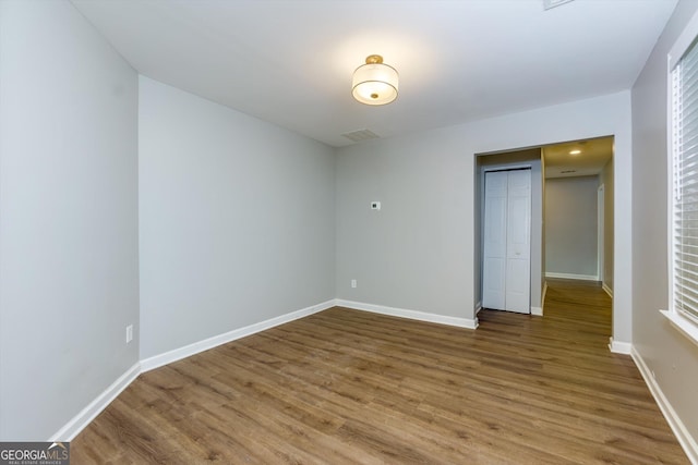 2911 Glenwood Ave SE, Atlanta, GA 30317 - unfurnished bedroom with wood-type flooring and a closet