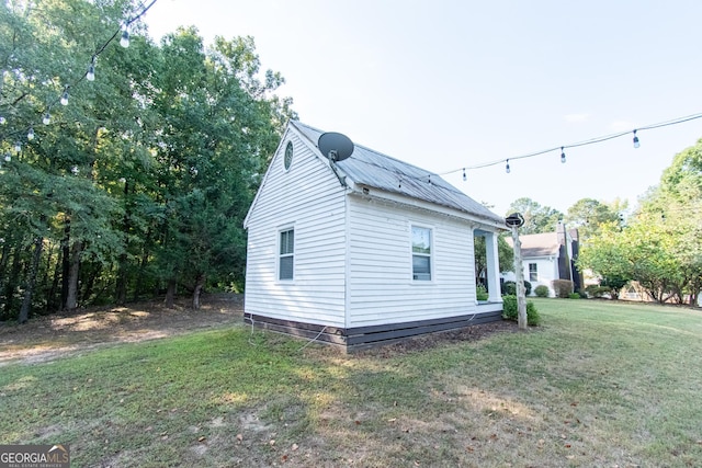 1651 Mergendollar Rd, Good Hope, GA 30641 - view of home's exterior with a yard and metal roof
