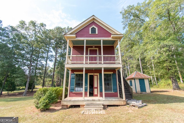1651 Mergendollar Rd, Good Hope, GA 30641 - back of house with an outbuilding, a yard, covered porch, a storage unit, and a balcony