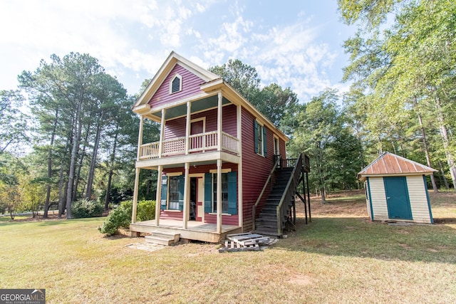 1651 Mergendollar Rd, Good Hope, GA 30641 - rear view of property featuring a storage shed, a yard, an outdoor structure, and stairs