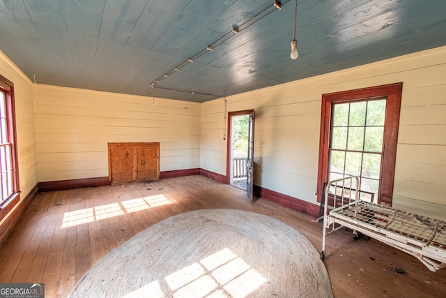 1651 Mergendollar Rd, Good Hope, GA 30641 - unfurnished room with baseboards, hardwood / wood-style flooring, and wood ceiling