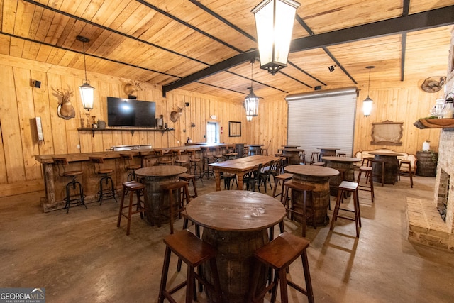 1651 Mergendollar Rd, Good Hope, GA 30641 - dining space featuring wood walls, finished concrete flooring, and wood ceiling