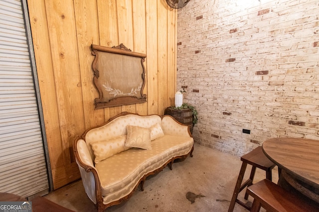 1651 Mergendollar Rd, Good Hope, GA 30641 - living area featuring wood walls, carpet, and brick wall