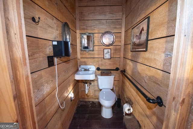 1651 Mergendollar Rd, Good Hope, GA 30641 - bathroom with wooden walls, toilet, and a sink