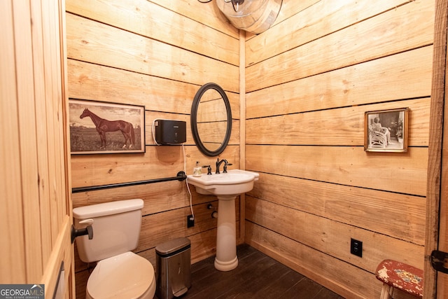 1651 Mergendollar Rd, Good Hope, GA 30641 - bathroom featuring wooden walls, toilet, and wood finished floors