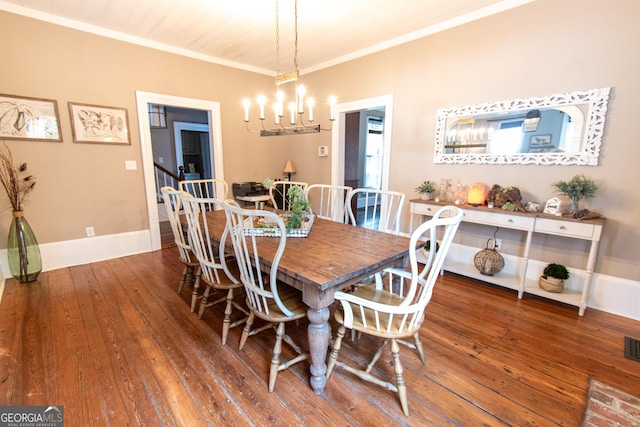 1651 Mergendollar Rd, Good Hope, GA 30641 - dining room featuring baseboards, an inviting chandelier, ornamental molding, visible vents, and hardwood / wood-style floors