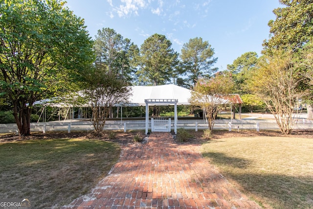 1651 Mergendollar Rd, Good Hope, GA 30641 - view of front facade featuring a pergola, a front yard, and fence