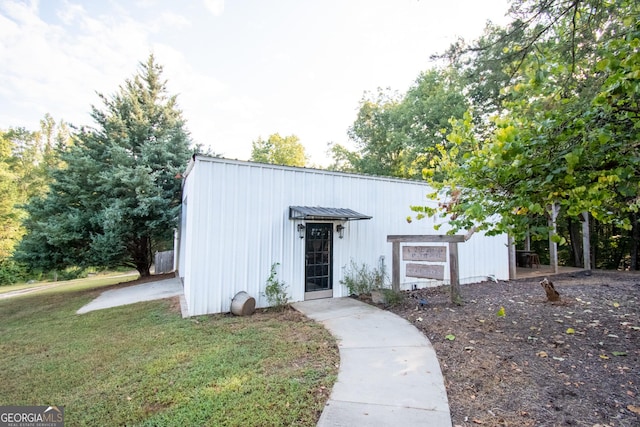 1651 Mergendollar Rd, Good Hope, GA 30641 - view of front of home with a front yard and metal roof