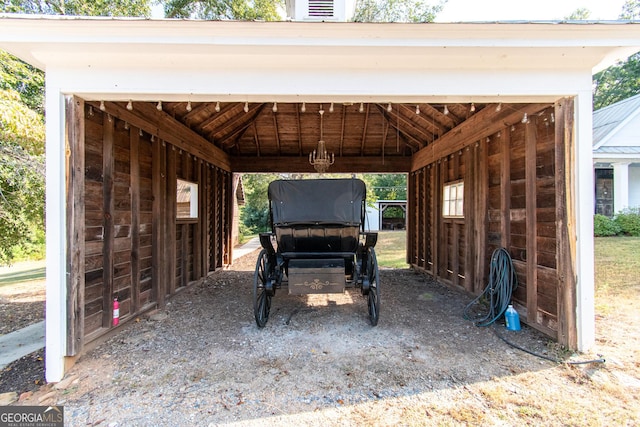 1651 Mergendollar Rd, Good Hope, GA 30641 - view of parking with a carport and an exterior structure