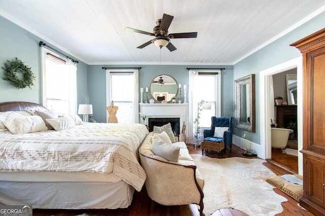 1651 Mergendollar Rd, Good Hope, GA 30641 - bedroom featuring crown molding, wood finished floors, a fireplace, and multiple windows