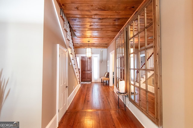 1651 Mergendollar Rd, Good Hope, GA 30641 - hall with wood-type flooring, wooden ceiling, baseboards, and stairs