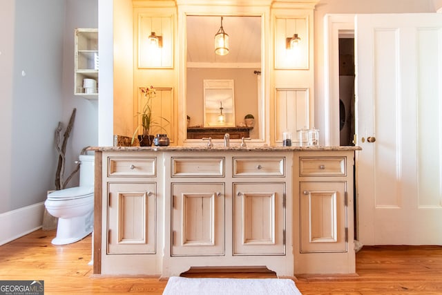 1651 Mergendollar Rd, Good Hope, GA 30641 - bathroom with toilet, vanity, and wood finished floors