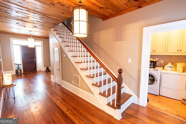 1651 Mergendollar Rd, Good Hope, GA 30641 - foyer with visible vents, stairway, wooden ceiling, washing machine and clothes dryer, and dark wood-style floors