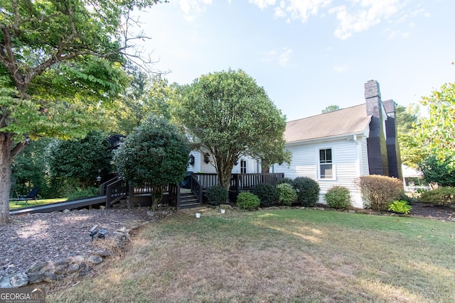1651 Mergendollar Rd, Good Hope, GA 30641 - exterior space featuring a front yard, a wooden deck, and a chimney