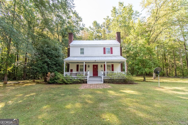 1651 Mergendollar Rd, Good Hope, GA 30641 - view of front of property featuring a front yard, a porch, metal roof, and a chimney