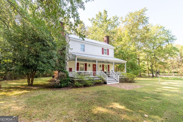 1651 Mergendollar Rd, Good Hope, GA 30641 - view of front facade featuring a porch, a chimney, and a front lawn