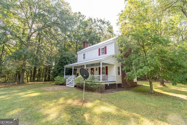 1651 Mergendollar Rd, Good Hope, GA 30641 - view of front of property featuring a front yard, a chimney, and covered porch
