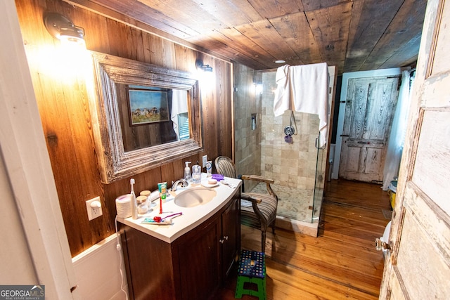 1651 Mergendollar Rd, Good Hope, GA 30641 - bathroom featuring a shower stall, vanity, wood ceiling, and hardwood / wood-style floors