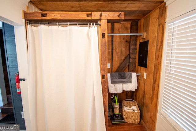 1651 Mergendollar Rd, Good Hope, GA 30641 - bathroom featuring electric panel, wooden walls, wooden ceiling, and wood finished floors
