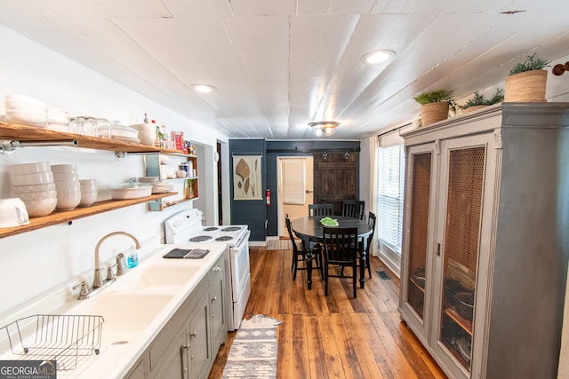 1651 Mergendollar Rd, Good Hope, GA 30641 - kitchen with gray cabinets, open shelves, white electric range, hardwood / wood-style floors, and a sink