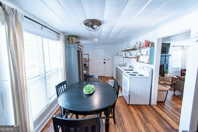 1651 Mergendollar Rd, Good Hope, GA 30641 - dining area featuring washer / clothes dryer, light wood-style floors, and a fireplace
