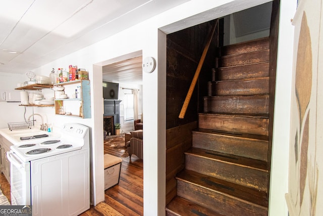 1651 Mergendollar Rd, Good Hope, GA 30641 - staircase with wood finished floors and a fireplace
