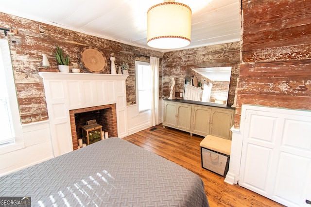1651 Mergendollar Rd, Good Hope, GA 30641 - bedroom featuring light wood-type flooring and a fireplace