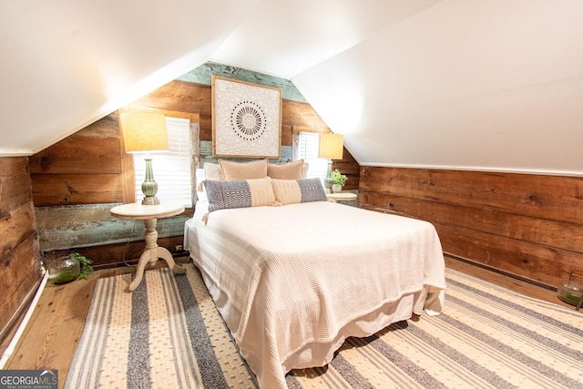 1651 Mergendollar Rd, Good Hope, GA 30641 - bedroom featuring wood walls, wood finished floors, and lofted ceiling