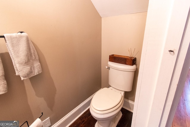 1651 Mergendollar Rd, Good Hope, GA 30641 - bathroom with lofted ceiling, baseboards, toilet, and wood finished floors