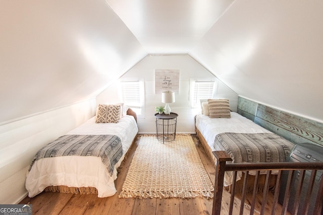 1651 Mergendollar Rd, Good Hope, GA 30641 - bedroom featuring lofted ceiling and hardwood / wood-style flooring
