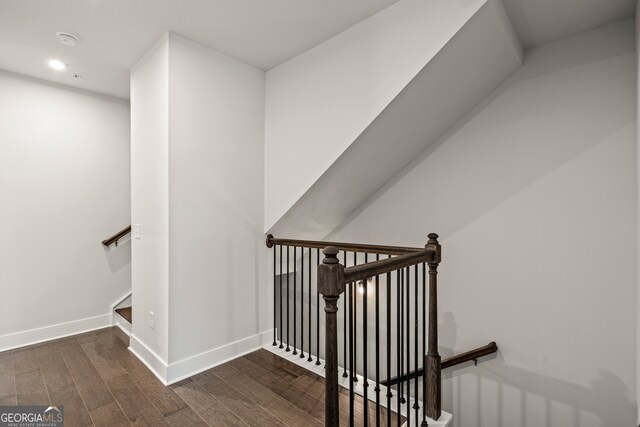 staircase featuring hardwood / wood-style floors