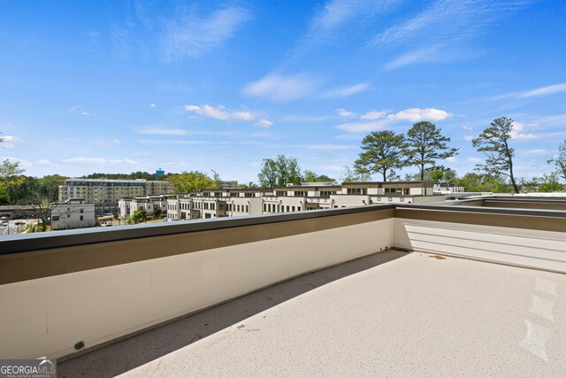 view of patio featuring a balcony