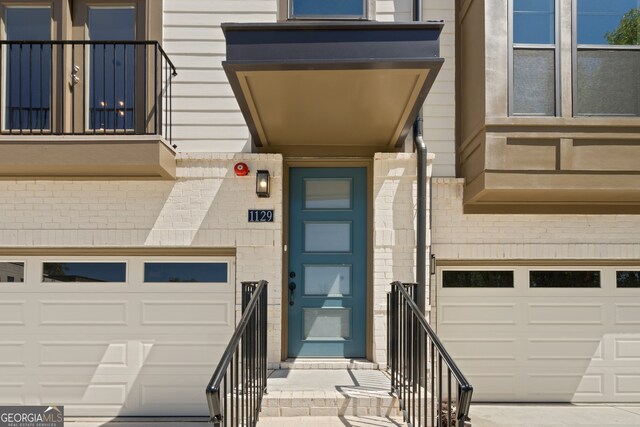 doorway to property featuring a garage