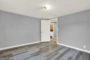 spare room featuring dark wood-type flooring