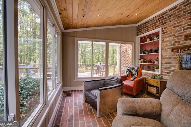 sunroom featuring wood ceiling, plenty of natural light, and vaulted ceiling