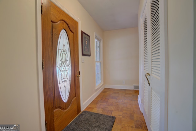 entrance foyer with parquet floors