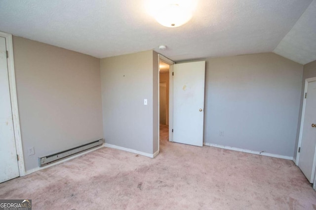 unfurnished bedroom with a baseboard radiator, lofted ceiling, a textured ceiling, and light colored carpet