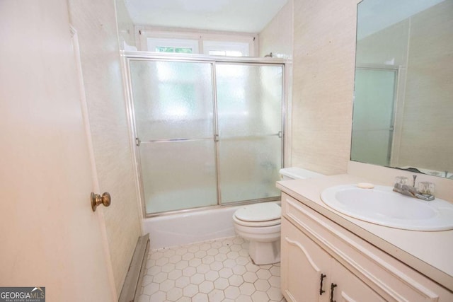 full bathroom with enclosed tub / shower combo, tile patterned flooring, vanity, and toilet