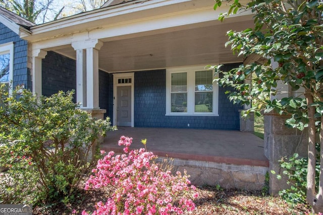 property entrance with covered porch