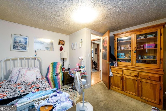 bedroom with a textured ceiling, light colored carpet, and crown molding