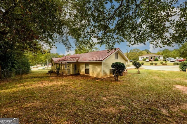 view of home's exterior featuring a lawn