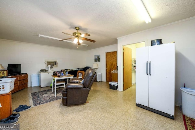 living room featuring a textured ceiling, radiator heating unit, ornamental molding, and ceiling fan